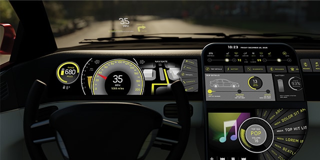 A POV shot of a modern dashboard with large screens.
