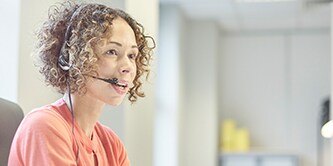 Person speaking on a headset
