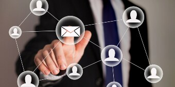 Person clicking an email button
