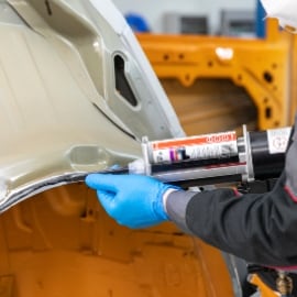 Applying adhesive to the panel