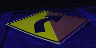 Fluorescent yellow road sign
