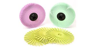 Image showing 1 pink, 1 green and 3 yellow Scotch-Brite™ Radial Bristle Discs on a white backgroung
