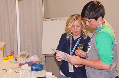 3M engineer Margaux Mitera with 2015 Discovery Education 3M Young Scientist Challenge finalist Conner Pettit during the Chain Reaction Challenge.