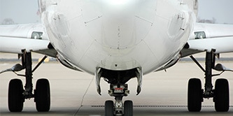 Upshot of the bottom of a plane and its landing gear.