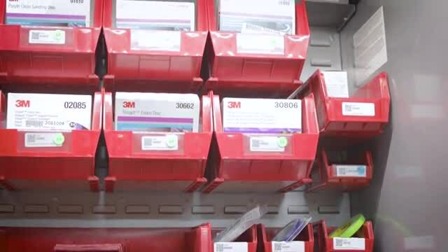 view of storage bins with repair stack tags
