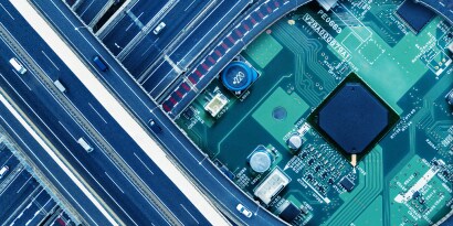 image of a circuit board with a highway with cars
