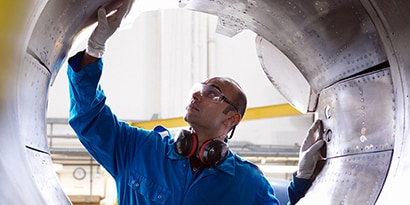 Airplane engineer inspecting reverse thruster of 737
