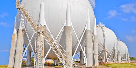 Cryogenic storage containers in a field
