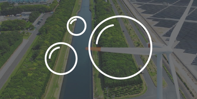 A bubble icon over a desaturated background of a highway next to a river and solar pannels.
