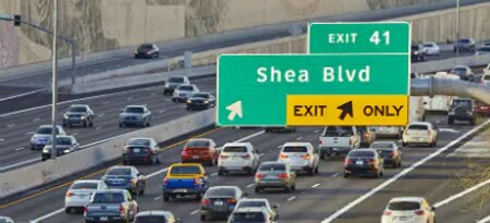 Overhead road signs on highway
