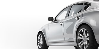 Side view of a grey sedan.