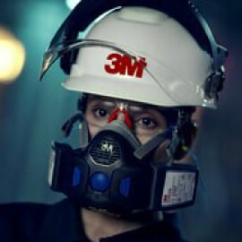 Woman using 3M Reusable Respirator Woman using 3M Reusable Respirator