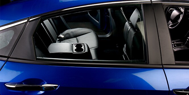 Exterior trim film on the door of a blue sedan.
