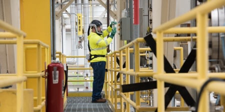 Man using ppe working in a chemical plant
