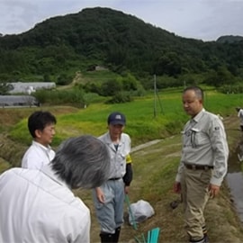 A student works to get everything right as he fits Hope with a prosthetic hand