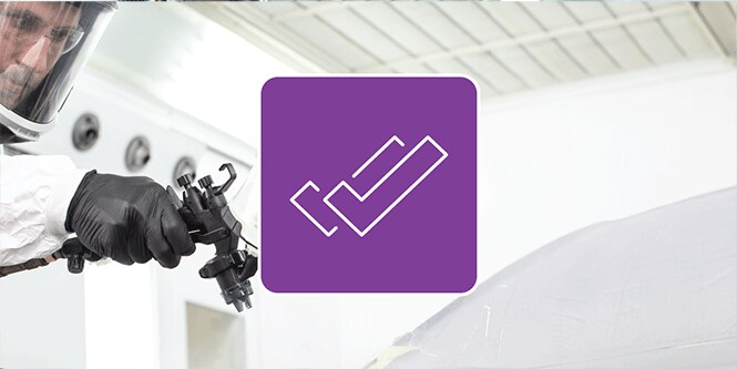 Paint technician spray a car with illustrative icon of checkmarks over the image
