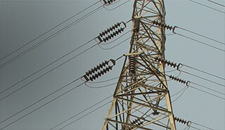 Image of an electrical tower in the 3M Newsroom story about  reinforcing the electrical capacity within the existing infrastructure.