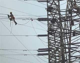 Image of electrial tower with a new kind of cable called 3M  Aluminium Conductor Composite Reinforced, or ACCR.