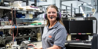 Woman using a 3M hearing protection
