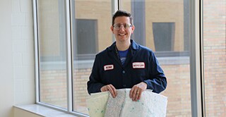 Kim Sachs, 3M product development manager, holding nonwoven material