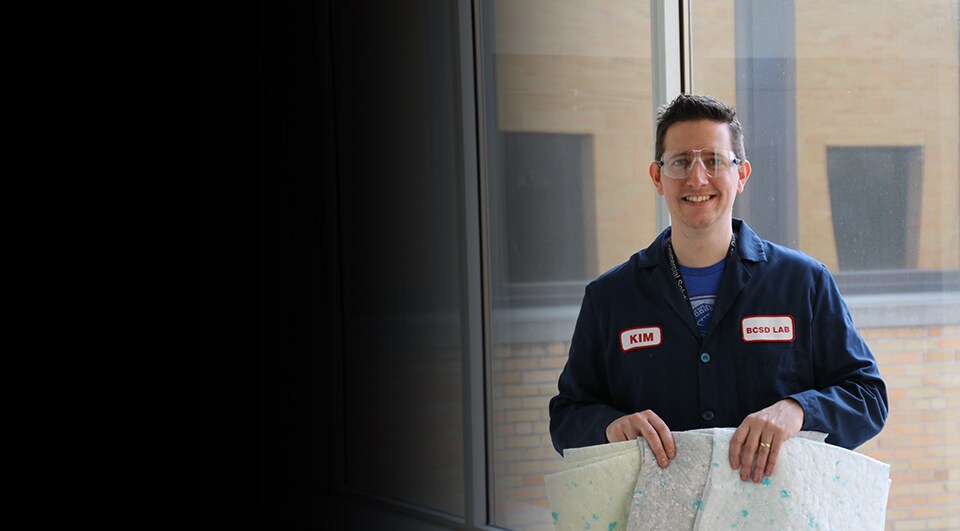 Kim Sachs, 3M product development manager, holding nonwoven material