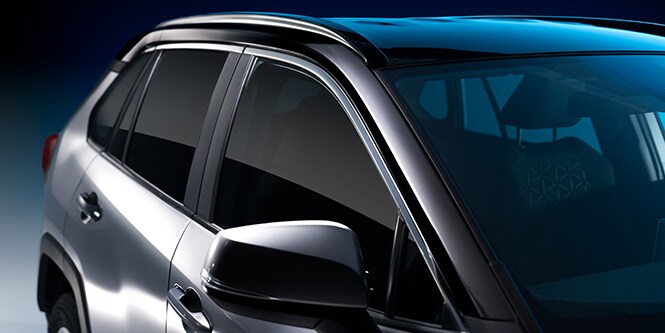 Sleek black body contrast film on the door sash of a grey SUV.
