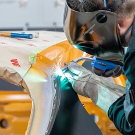 Person welding the panels